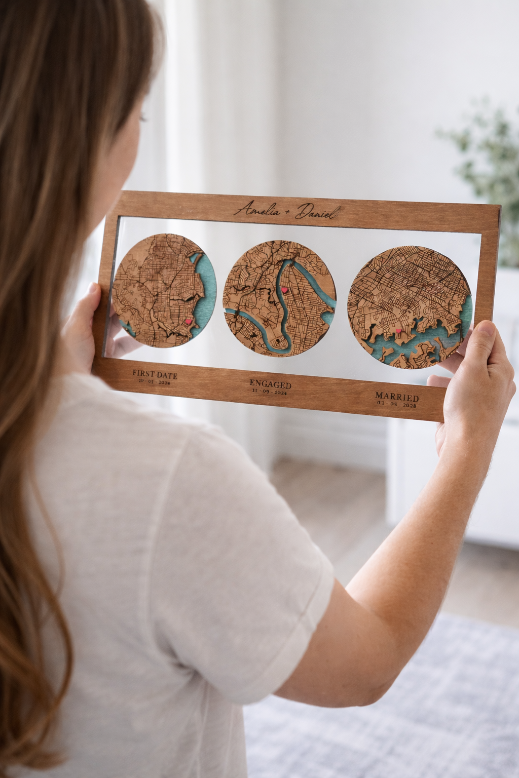 Woman holding personalised wooden map timeline gift with engraved locations and layered timber design