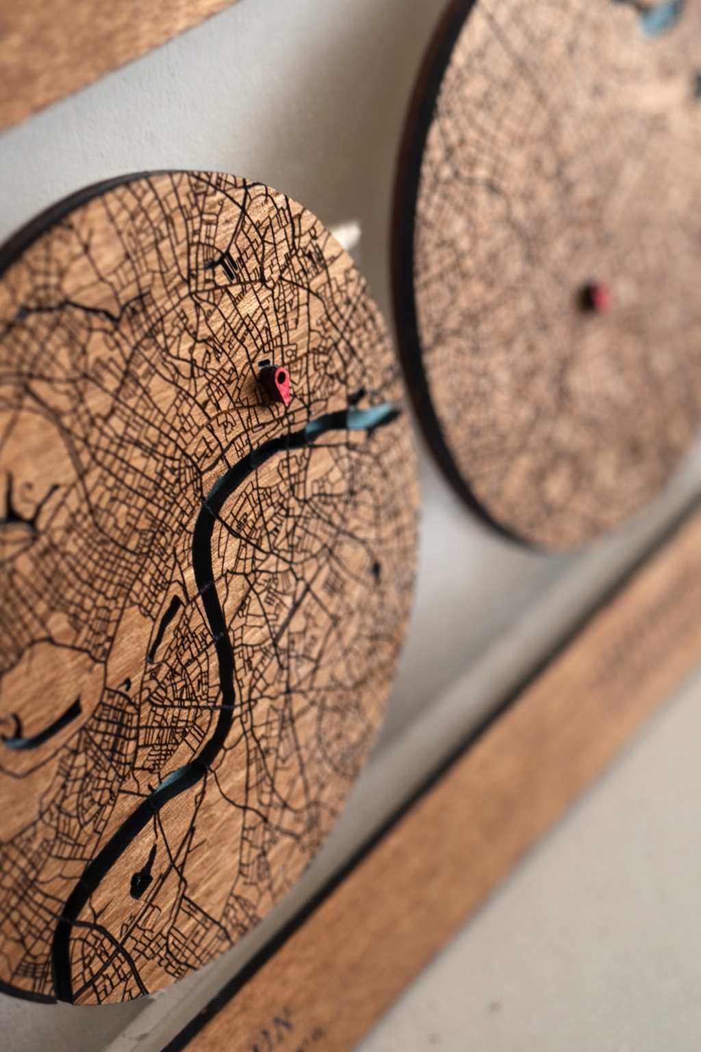 Closeup of engraved layered wood map gift