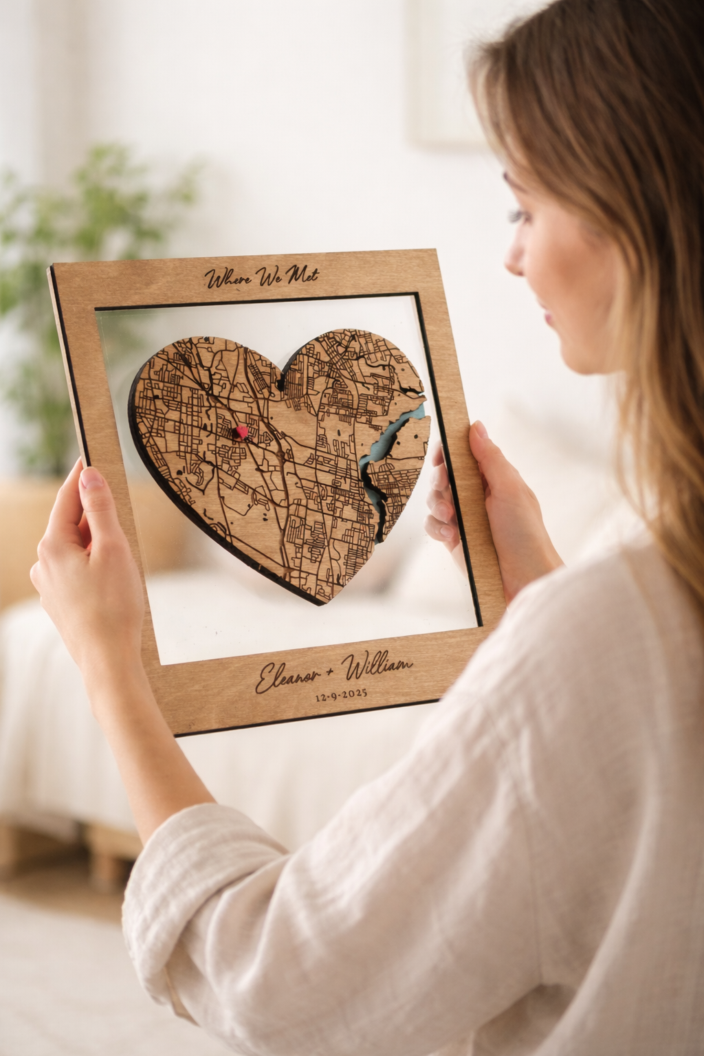 woman holding heart shaped where we met map gift